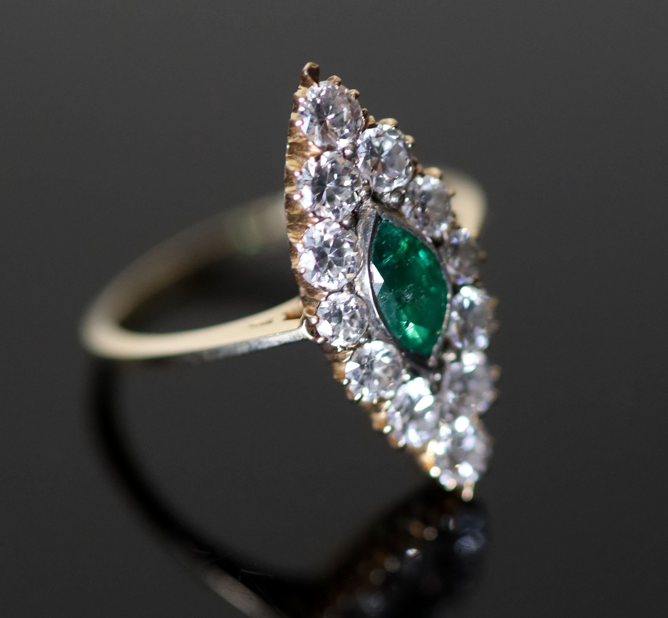 A Victorian style gold, emerald and diamond cluster set marquise shaped ring,